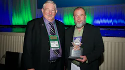 Past EASA Chairman Tim Bieber (left) presents EASA's 2023 Exceptional Achievement Service Award to Dennis Franklin.