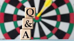 question answer blocks in front of dart board