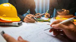 team working on construction plans