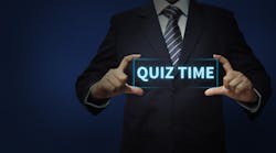 man in suit holding the words quiz time