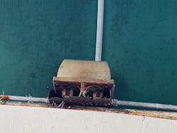 rusted light fixture mounted underneath an awning rusted light fixture mounted underneath an awning