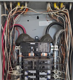 Photo 2. Duct seal was used to cover these supply-side terminals. Photo 2. Duct seal was used to cover these supply-side terminals.