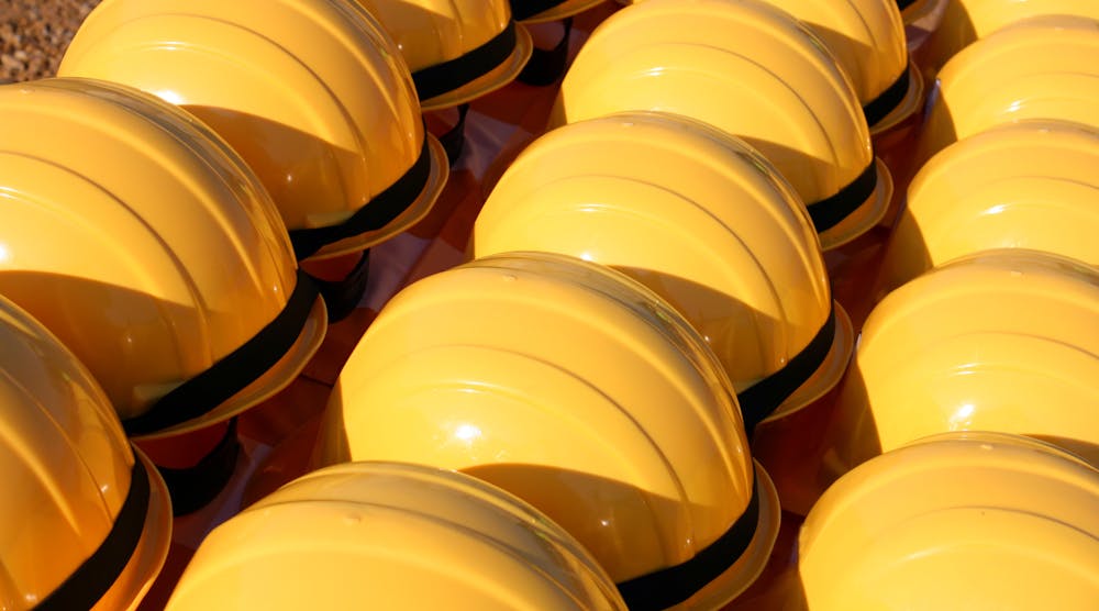 yellow construction helmets in rows