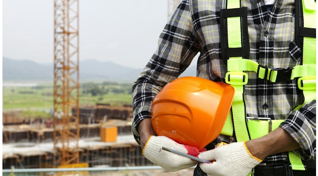 construction worker holding helmet