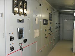 Photo 2. The red arrow points to the location of a battery system, which is hidden behind the middle door of this electrical equipment lineup. Photo 2. The red arrow points to the location of a battery system, which is hidden behind the middle door of this electrical equipment lineup.