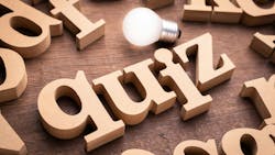 Wooden blocks that spell out 'quiz' with a light bulb above it Wooden blocks that spell out 'quiz' with a light bulb above it