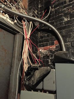 gaping hole bashed through the wall above the door to this electric room gaping hole bashed through the wall above the door to this electric room