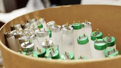 A bunch of fluorescent tube lights inside of a round barrel A bunch of fluorescent tube lights inside of a round barrel