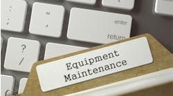 A folder with a tab that says 'Equipment Maintenance' rests on top of a keyboard. A folder with a tab that says 'Equipment Maintenance' rests on top of a keyboard.