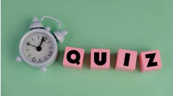 Pink blocks that spell 'quiz' against a light green background next to a white alarm clock. Pink blocks that spell 'quiz' against a light green background next to a white alarm clock.