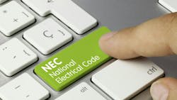 A finger presses a green key on a keyboard that says 'NEC National Electrical Code' A finger presses a green key on a keyboard that says 'NEC National Electrical Code'