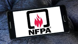 A smart phone is laying sideways on a dark background. The screen shows the NFPA logo against a plain white background. A smart phone is laying sideways on a dark background. The screen shows the NFPA logo against a plain white background.