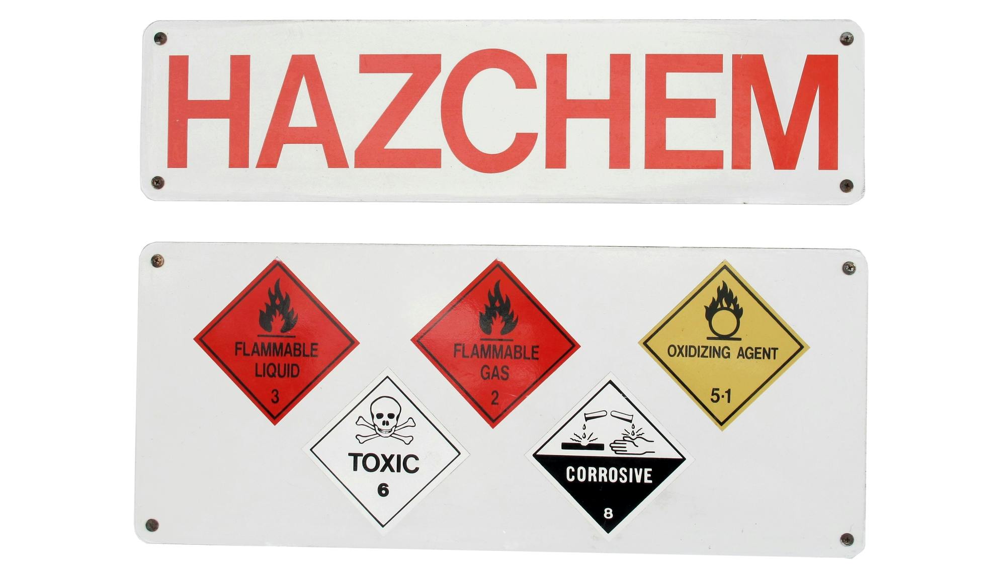 A white sign that says 'HAZCHEM' in all caps along with hazard sign symbols.