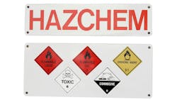 A white sign that says 'HAZCHEM' in all caps along with hazard sign symbols. A white sign that says 'HAZCHEM' in all caps along with hazard sign symbols.