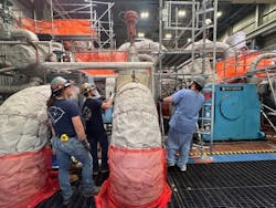 Workers inspect turbines at the Palisades Nuclear Generating Station. Workers inspect turbines at the Palisades Nuclear Generating Station.