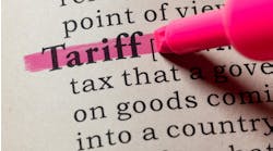 A close up of the dictionary definition for 'tariff.' A pink highlighter has highlighted the word 'tariff'. A close up of the dictionary definition for 'tariff.' A pink highlighter has highlighted the word 'tariff'.