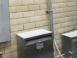 Photo 1. Flour dust is a Class II, Group G combustible dust. Compliance with installation and protection methods in Art. 500 and Art. 502 are required. Wheat flour (whether in a cloud or a layer), as shown in this image, has an ignition temperature of 680°F (360°C). The combustible dust accumulating on top of the transformers not only affects the cooling of the transformer but could also be ignited by a failure of the equipment. Note the ventilation opening where combustible dust has no doubt entered the interior of the transformer. Photo 1. Flour dust is a Class II, Group G combustible dust. Compliance with installation and protection methods in Art. 500 and Art. 502 are required. Wheat flour (whether in a cloud or a layer), as shown in this image, has an ignition temperature of 680°F (360°C). The combustible dust accumulating on top of the transformers not only affects the cooling of the transformer but could also be ignited by a failure of the equipment. Note the ventilation opening where combustible dust has no doubt entered the interior of the transformer.