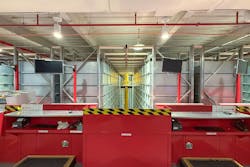 A view from the second-floor work platform showcases the newly installed LED overhead lights. Small cylinders replaced the compact fluorescent fixtures. A view from the second-floor work platform showcases the newly installed LED overhead lights. Small cylinders replaced the compact fluorescent fixtures.