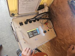 Photo 4. Qualification testing can only be done with an AC testing machine. This is performed by qualified service personnel. It is performed anytime the fiberglass boom section is modified or replaced. A record of dielectric tests should be maintained in written, dated, and signed form. Photo 4. Qualification testing can only be done with an AC testing machine. This is performed by qualified service personnel. It is performed anytime the fiberglass boom section is modified or replaced. A record of dielectric tests should be maintained in written, dated, and signed form.