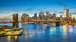 Famous view of New York City over the East River towards the financial district in the borough of Manhattan. Famous view of New York City over the East River towards the financial district in the borough of Manhattan.