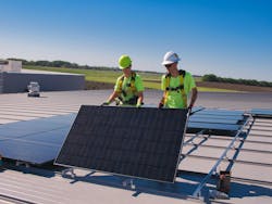 Good Energy Solutions solar workers install solar on the roof of the Evergy Salina Service Center in May 2025. Good Energy Solutions solar workers install solar on the roof of the Evergy Salina Service Center in May 2025.