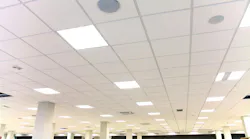 Modern design white office ceiling with white tiles and lighting