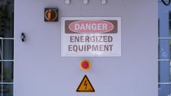 This image shows a close-up of an energized equipment warning sign, featuring a danger sign and emergency stop button. The safety measures are clearly visible, indicating high-voltage equipment. The image was generated by AI, highlighting the potential of AI in creating realistic visuals for safety This image shows a close-up of an energized equipment warning sign, featuring a danger sign and emergency stop button. The safety measures are clearly visible, indicating high-voltage equipment. The image was generated by AI, highlighting the potential of AI in creating realistic visuals for safety
