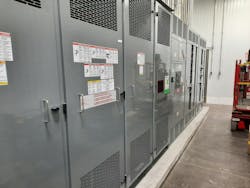 Photo 2. Dry-type transformer with vents at top and bottom. Internal fans help to cool the transformer. Photo 2. Dry-type transformer with vents at top and bottom. Internal fans help to cool the transformer.