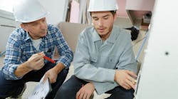 Electrician and apprentice Electrician and apprentice