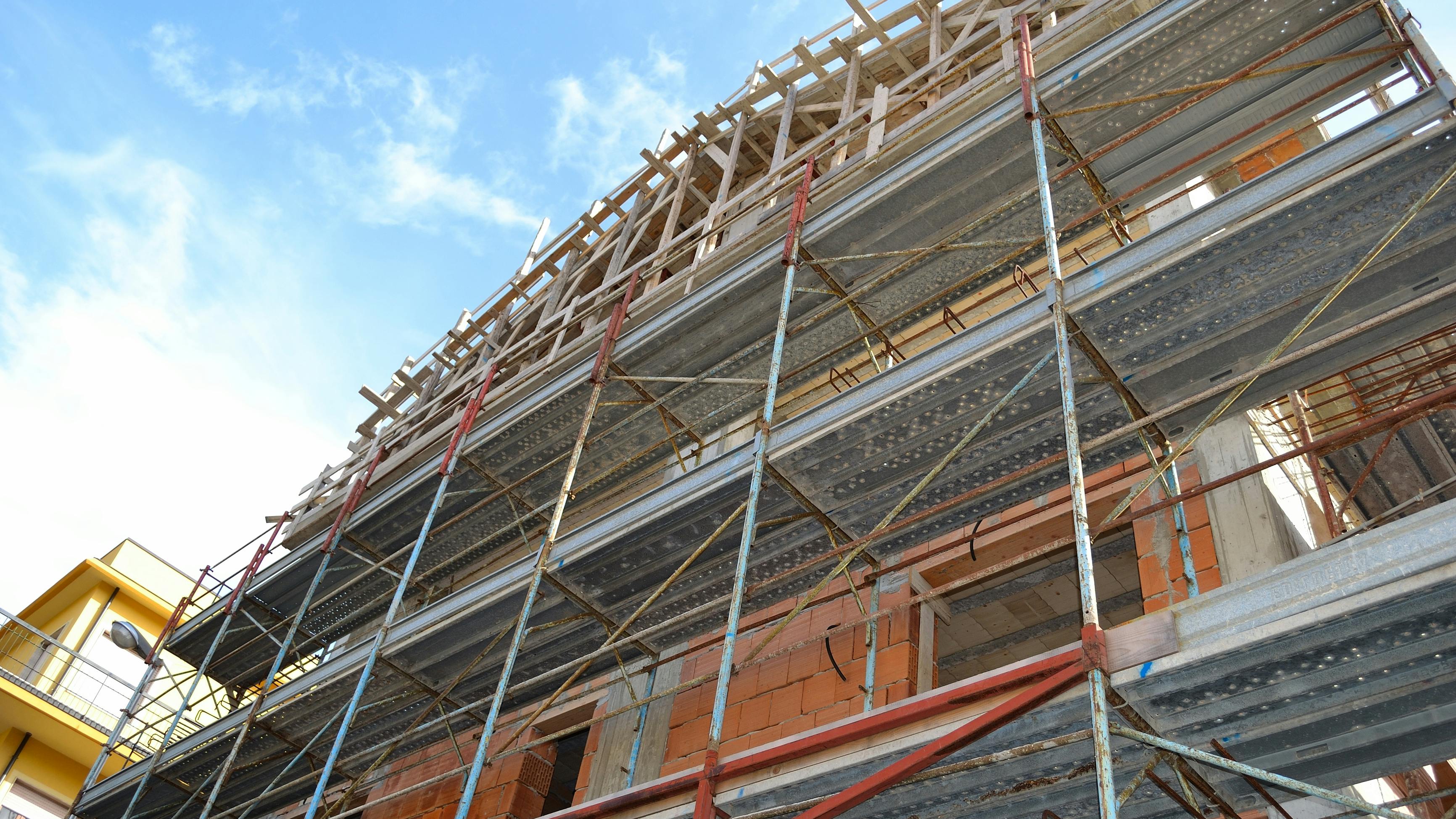 A building under construction with scaffolding around it
