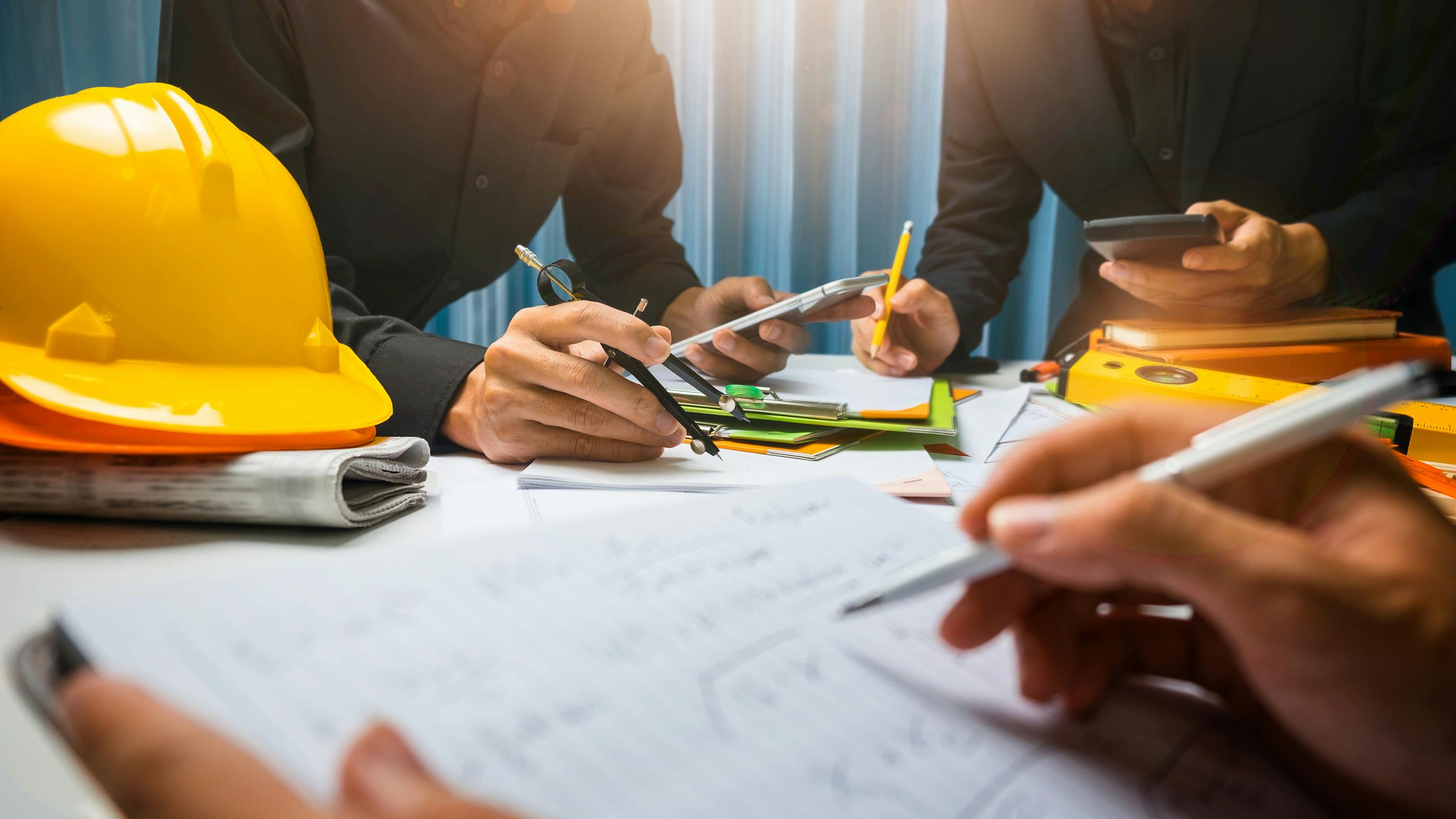Teamwork of business man contractor working meeting in the office construction site on their architect project.