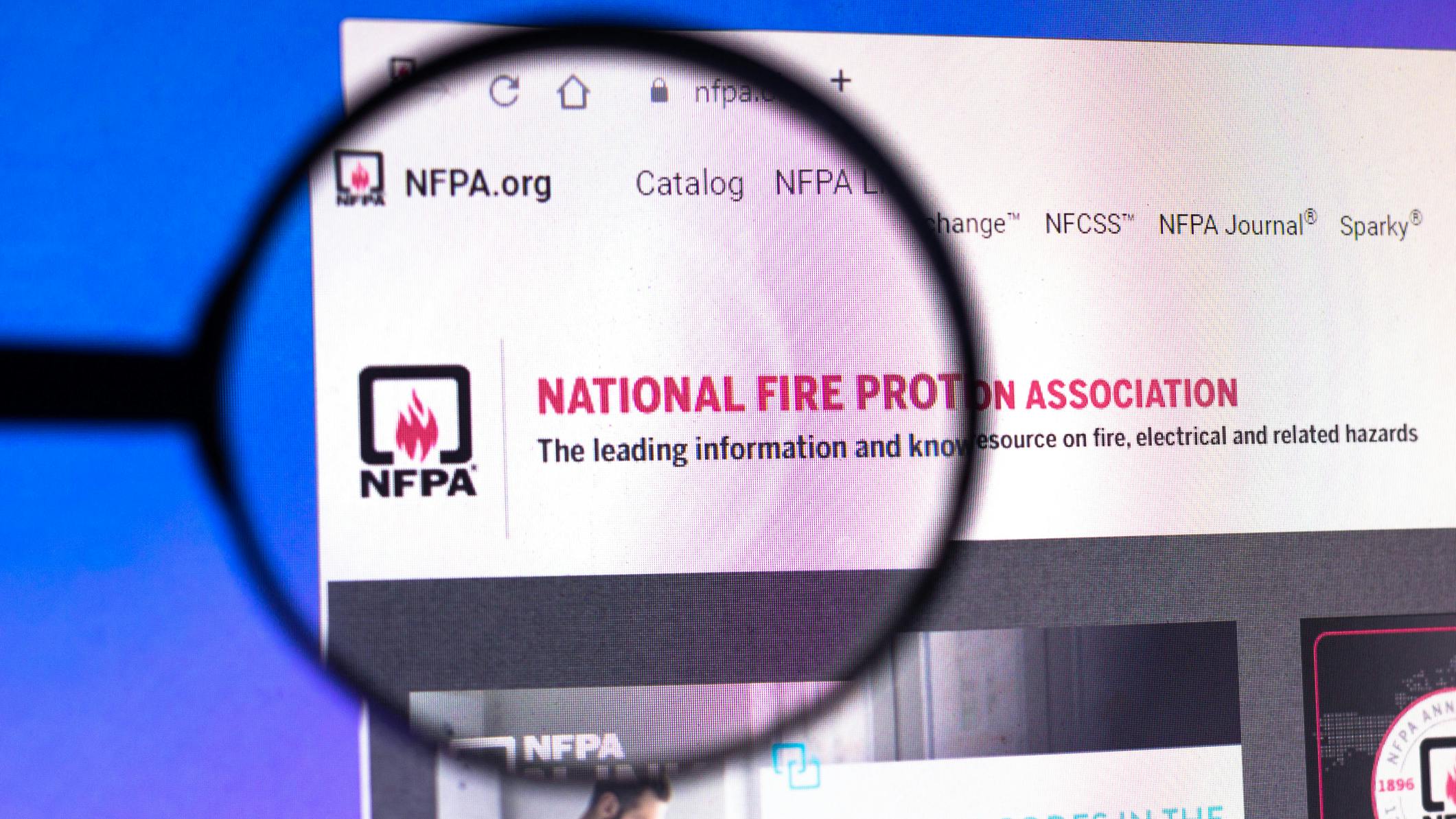 In this photo illustration the homepage of the National Fire Protection Association NFPA magnifying glass.