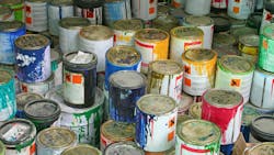 A collection of old paint cans A collection of old paint cans