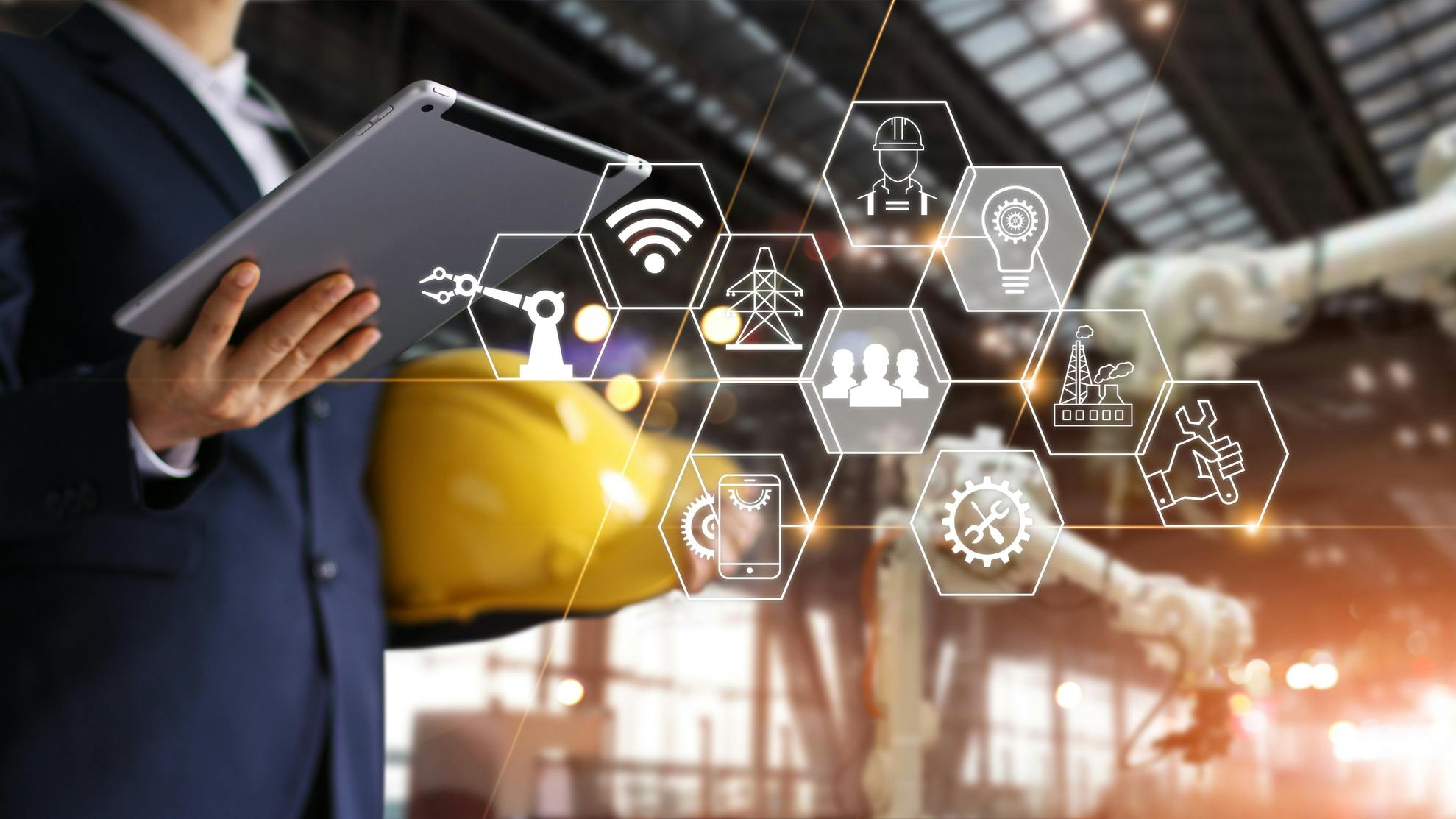 Engineer manager using tablet with icon network, Industrial robotics, Automation robot arms machine in intelligent construction site. Construction technology concept