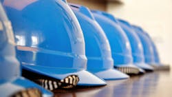 blue construction helmets in a row blue construction helmets in a row