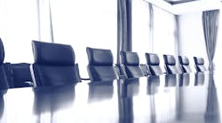row of meeting room chairs at a table row of meeting room chairs at a table