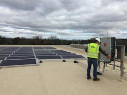 Photo 1. Rooftop-mounted solar PV array. Photo 1. Rooftop-mounted solar PV array.