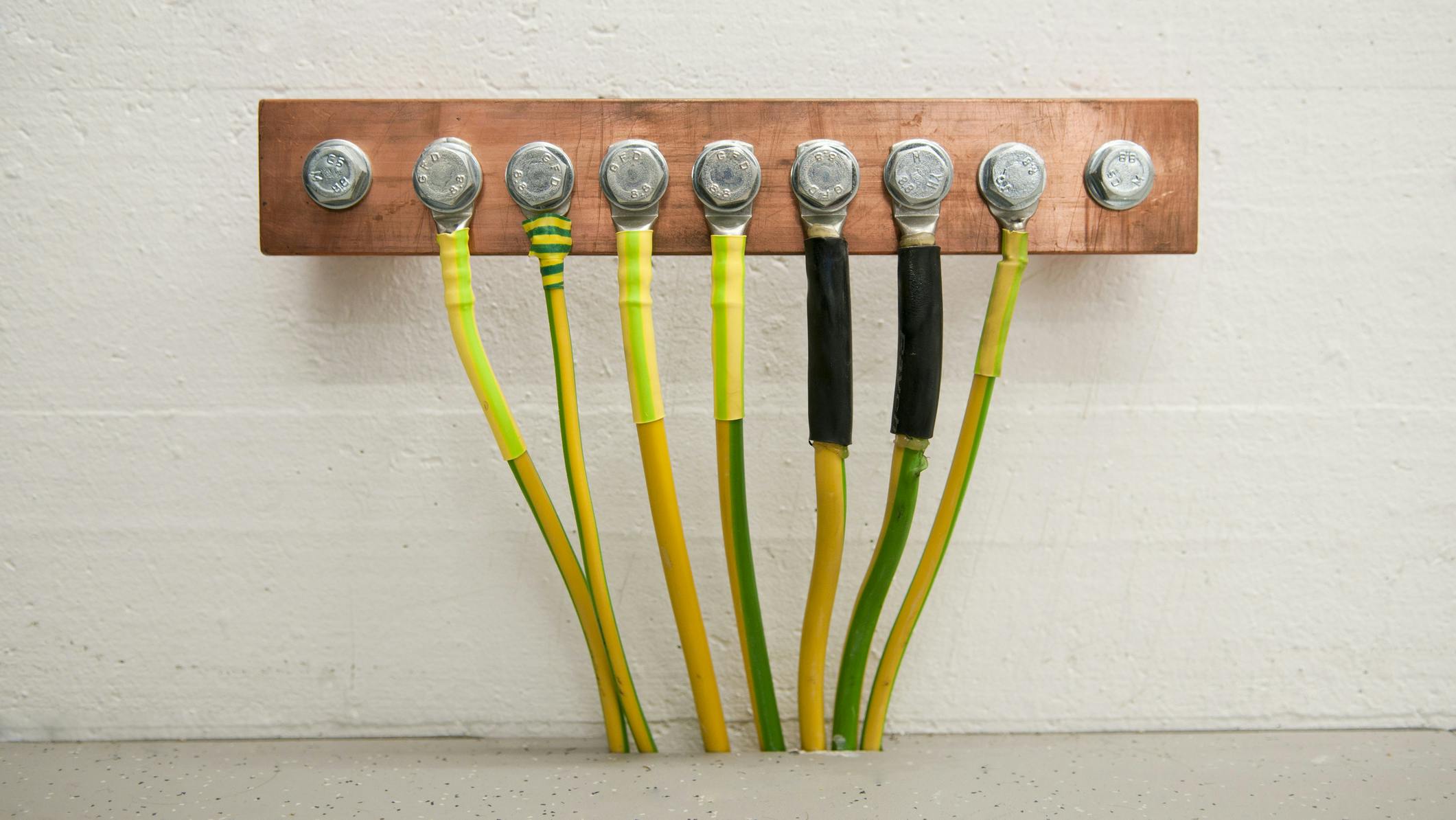 Grounding with cables. Electrical grounding on a copper bar in a it server room