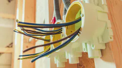 Electrical Wires and Installations in a Residential Construction Project. Electric wires are organized in junction boxes as part of home wiring during a construction project. This process ensures safety and efficiency in electrical systems Electrical Wires and Installations in a Residential Construction Project. Electric wires are organized in junction boxes as part of home wiring during a construction project. This process ensures safety and efficiency in electrical systems