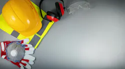 Occupational safety and health - work safety items of construction industry on gray background with copy space Occupational safety and health - work safety items of construction industry on gray background with copy space