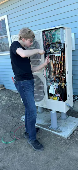 Matthew McPeck, a 2025 graduate of the Ulster BOCES Electrical Construction and Maintenance program, completes the electrical connections for a ductless mini-split heat pump system in a Habitat for Humanity home. As part of the installation, he wired a dedicated 240V, 40A branch circuit using No. 8 copper conductors. Through projects like this, students gain hands-on experience installing today’s energy-efficient heating and cooling systems while helping build affordable housing for local families. These real-world opportunities develop the technical skills, confidence, and commitment to service that prepare students for successful careers in the electrical industry.