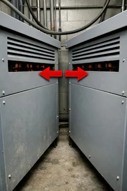 Photo 1. These transformers are inches apart with vents facing each other. They are feeding their heat to each other.