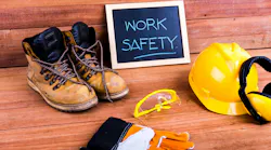 Safety first. Standard construction safety equipment on wood background
