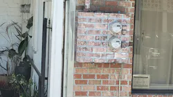 A talented painter visited this two-family dwelling. Despite its camouflage, there are two service disconnects for this two-family dwelling. They are outdoors, as required by Sec. 230.70(A)(1), but the markings in Sec. 230.70(B)(2) need to be applied.