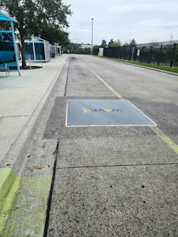 In-ground electric vehicle charger.