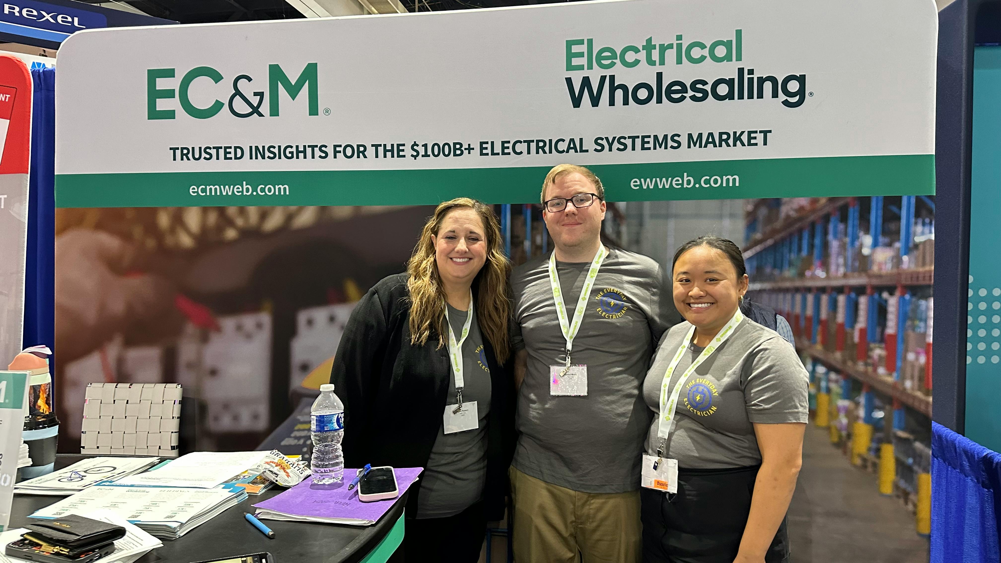 The EC&amp;M editorial team shows off the Everyday Electrician shirts, which NECA attendees can get for free if they visit Booth No. 2028.