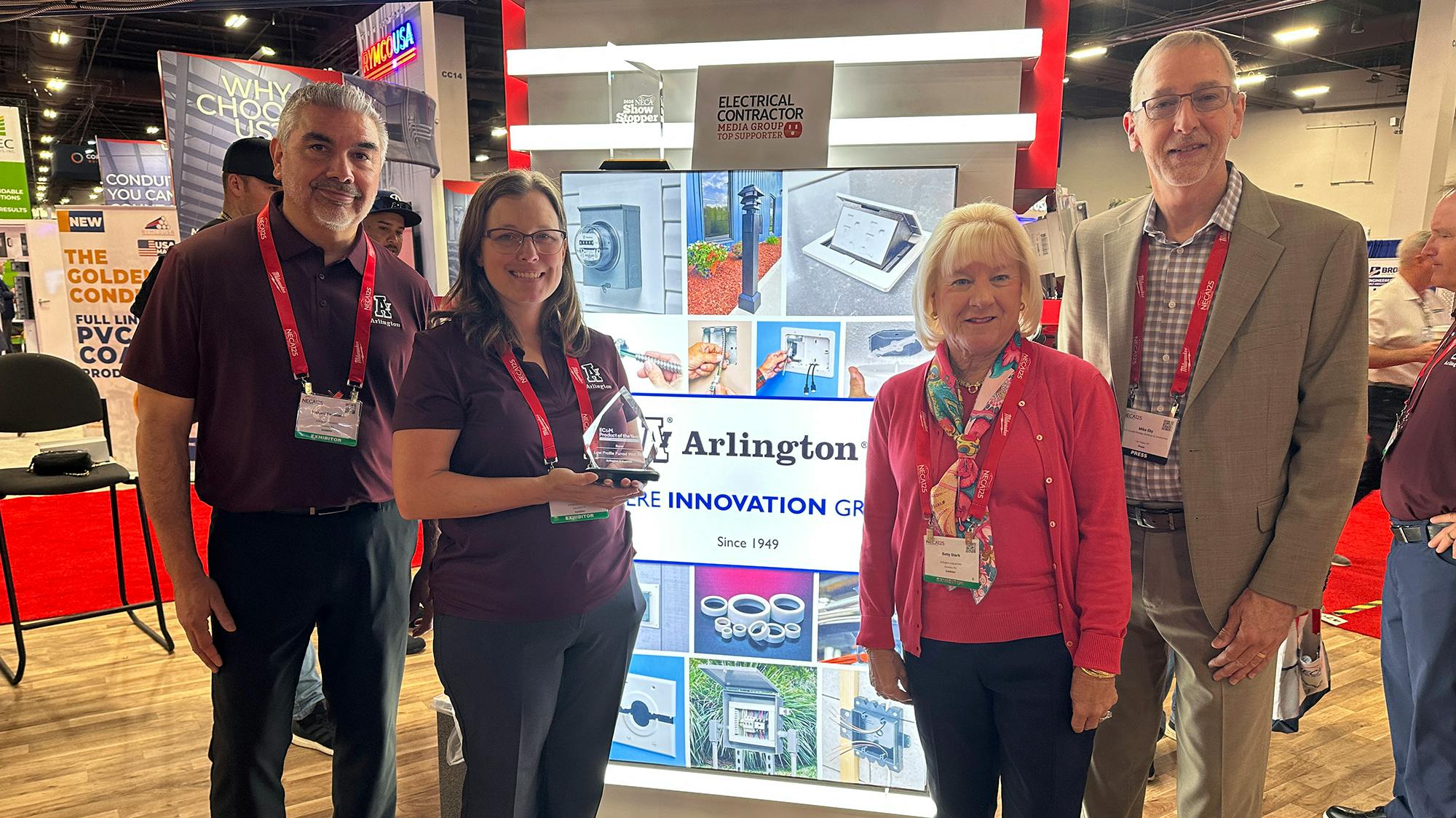 Mike Eby, VP of Content Strategy for the Buildings and Construction Group, stopped by Booth 4700 to present EC&amp;M's 2026 Product of the Year Gold award to Arlington Industries at the NECA 2026 show. Pictured from left are Arlington's Richard Temblador, Kris Gager, and Betty Stark and Mike Eby from EC&amp;M.