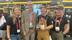 Mike Eby, VP of Content Strategy for the Buildings and Construction Group, presents Rack-A-Tiers with EC&M's 2026 Product of the Year overall Platinum award for its Wire Waffle at the NECA 2026 show. Pictured from left are: Allison Menzies, Rack-A-Tiers; Mike Eby, EC&M; Hunter Franssen, Wire Waffle; and Randall Franssen, Franssen's Electric.